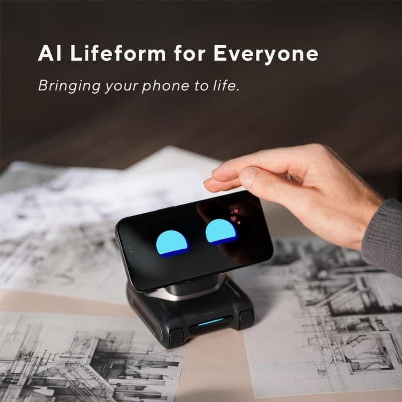 LOOI Robot avec Chat GPT transformant un smartphone en visage animé, yeux bleus lumineux, base motorisée compacte noire sur bureau avec croquis