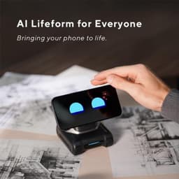 LOOI Robot avec Chat GPT transformant un smartphone en visage animé, yeux bleus lumineux, base motorisée compacte noire sur bureau avec croquis