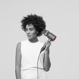 Sèche-cheveux Dyson Supersonic Iron Buse fuchsia/gris avec peigne