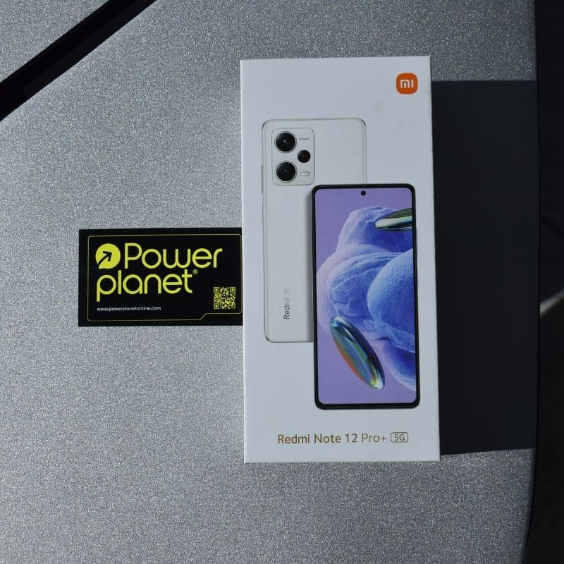 Caixa do Xiaomi Redmi Note 12 Pro+ 5G preta, exibindo imagem do smartphone com câmera tripla traseira e tela perfurada; logotipo mi visível na embalagem.