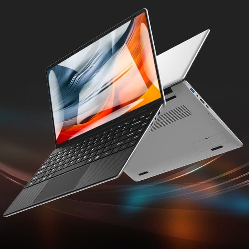Ordinateur portable mince 14 pouces argent, écran bord à bord lumineux, clavier sombre texturé, ports latéraux USB et HDMI, châssis léger et épuré