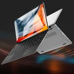 Ordinateur portable mince 14 pouces argent, écran bord à bord lumineux, clavier sombre texturé, ports latéraux USB et HDMI, châssis léger et épuré