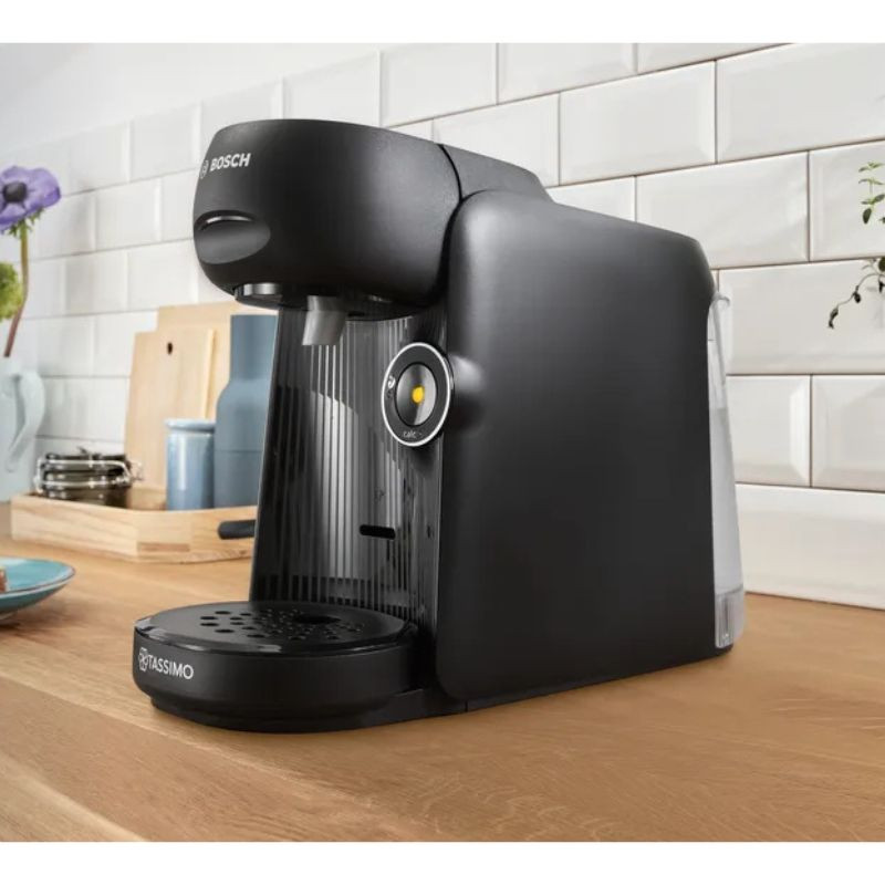 Bosch Tassimo Finesse TAS16B2, cafetera de cápsulas compacta en negro mate con panel estriado, boquilla central, bandeja antigoteo y botón circular iluminado - Ítem1