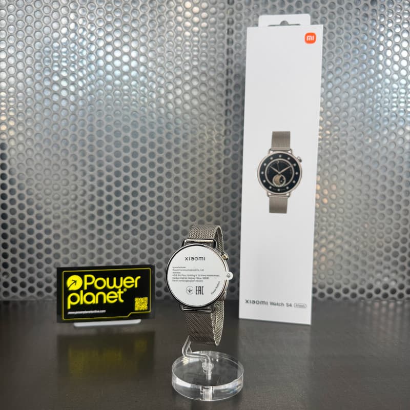Xiaomi Watch S4 41 mm dourado com pulseira milanesa em metal, mostrador circular elegante, acabamento premium e embalagem ao fundo exibindo o modelo