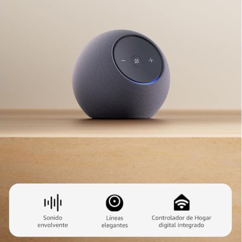 Alto-falante inteligente esférico grafite com tecido mesh, anel de luz azul, botões de volume e microfone no topo; design compacto e elegante