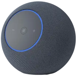Amazon Echo Studio Grafito, altavoz esférico gris con malla textil, aro LED azul y panel superior con botones +, − y acción. Diseño moderno y minimalista