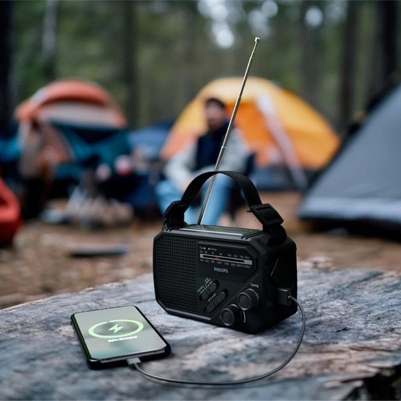Philips TAR1609/00 radio portable noire avec poignée, antenne télescopique, haut-parleur frontal, boutons rotatifs, lampe torche intégrée et port USB de