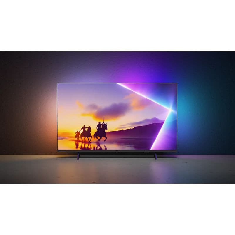Philips 55PUS8450/12 TV 55 pouces 4K Ultra HD QLED avec Ambilight tricolore, bords fins, écran plat lumineux affichant scène colorée sur fond sombre