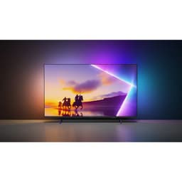 Philips 55PUS8450/12 TV 55 pouces 4K Ultra HD QLED avec Ambilight tricolore, bords fins, écran plat lumineux affichant scène colorée sur fond sombre