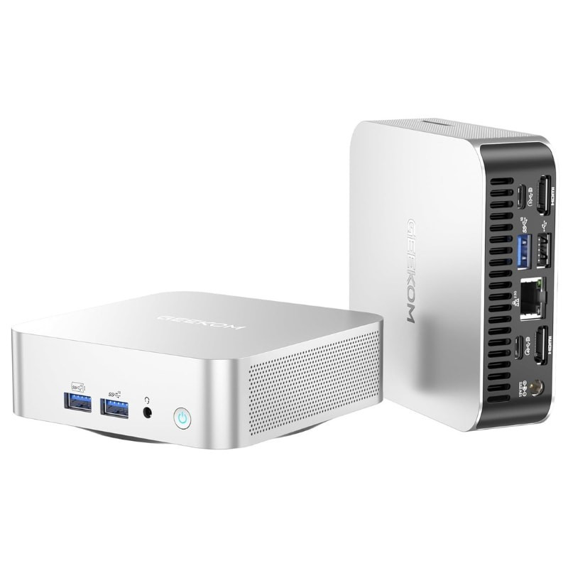 Mini PC prata compacto com corpo metálico, portas frontais USB e botão de energia, laterais ventiladas e traseira com HDMI, USB, Ethernet e áudio - Item