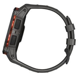 Garmin Instinct 3 50 mm Solar preto com pulseira de silicone carvão, caixa robusta cinza, botões laterais texturizados e aro laranja metálico NFC