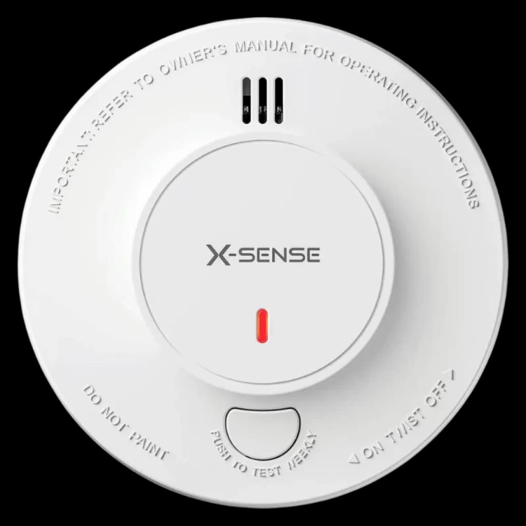 Detector de Humo redondo blanco con rejillas superiores, LED rojo central, botón de prueba grande y texto grabado en el borde