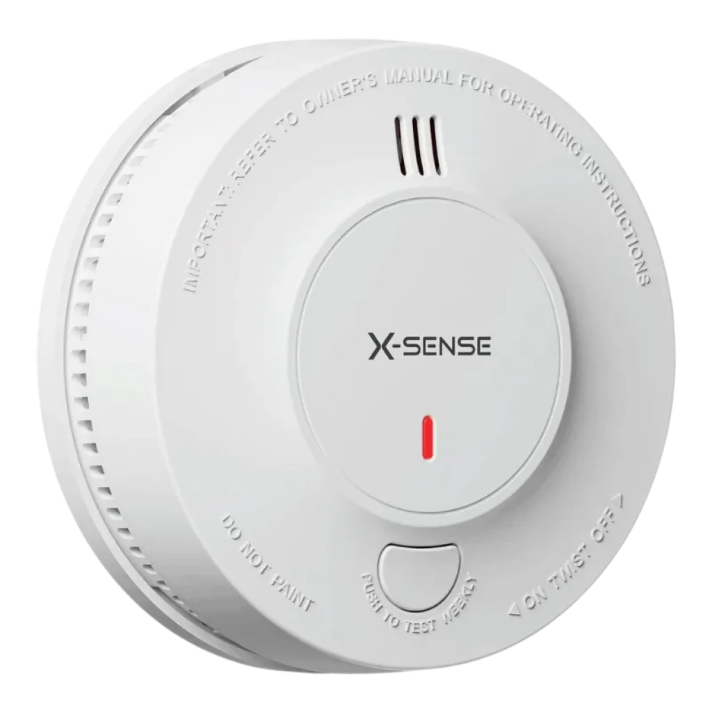 Detector de Humo redondo blanco con rejillas superiores, LED rojo central, botón de prueba grande y texto grabado en el borde - Ítem1