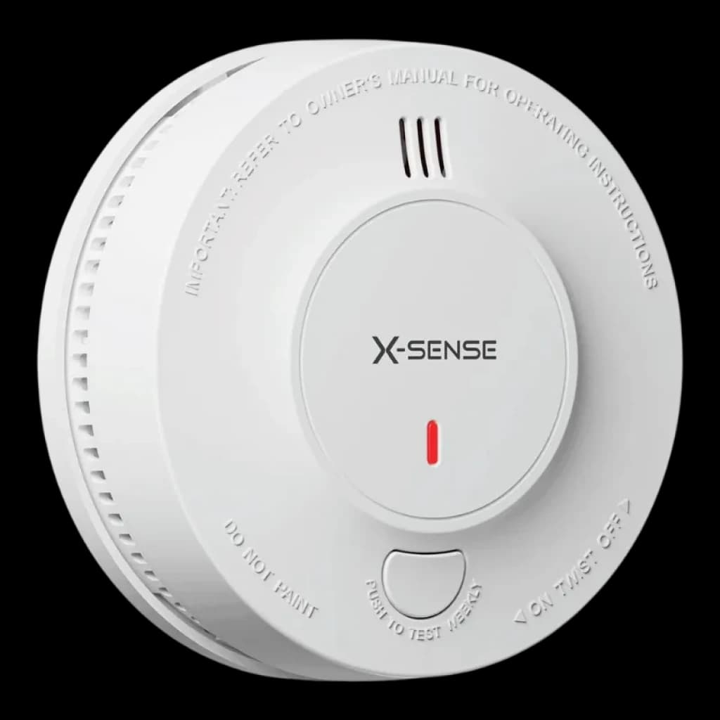 Detector de Humo blanco circular con rejilla lateral, LED rojo, rejilla de ventilación superior y botón central para prueba y silencio