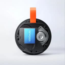 Module interne d’enceinte portable vert avec boucle orange, batterie 1000 mAh mise en évidence, circuit imprimé visible et haut‑parleur circulaire