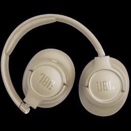 JBL Tune 730BT bege, auscultadores circum-aurais sem fios com conchas ovais, arco almofadado e dobrável, acabamento fosco e logotipo JBL prateado