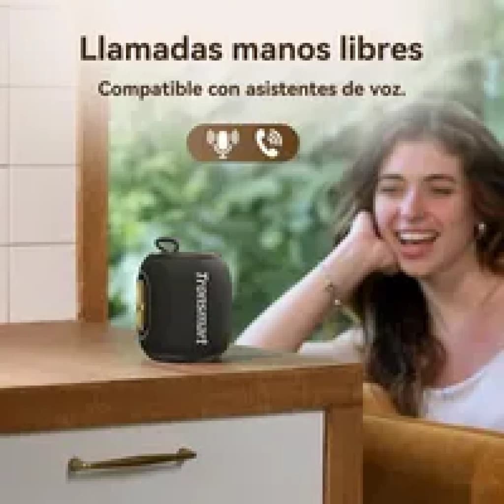 Enceinte Bluetooth compacte bleue 16 W avec bande latérale dorée, logo Tronsmart, sangle de transport et voyants, posée sur un meuble intérieur