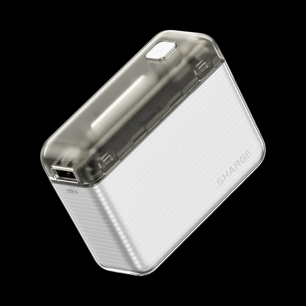 SHARGE Flow 20W 10000 mAh Transparente Power Bank con carcasa translúcida gris, cuerpo estriado blanco, puerto USB y esquinas redondeadas compactas