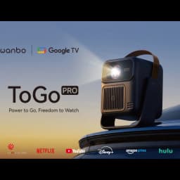 Projetor portátil Wanbo ToGo Pro 1080p, 500 ANSI lúmens, design compacto com alça marrom, lente frontal iluminada e grelha de ventilação central