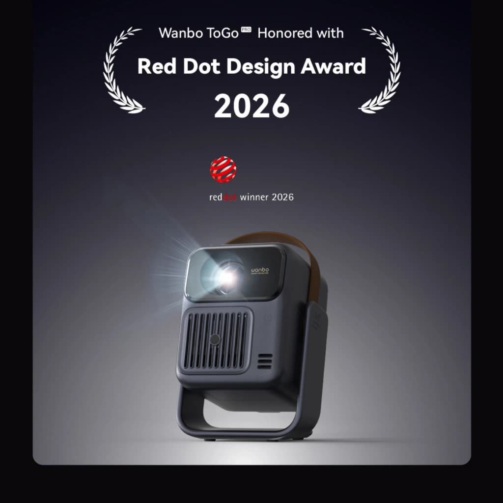 Projetor portátil Wanbo ToGo Pro 1080p com 500 ANSI lúmens, design premiado Red Dot 2026, corpo compacto cinza, alça integrada e lente frontal iluminada