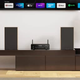 Arylic B50 Amplificador Bluetooth 5.2 negro con perilla grande, antenas duales, botones frontales y panel minimalista entre dos altavoces