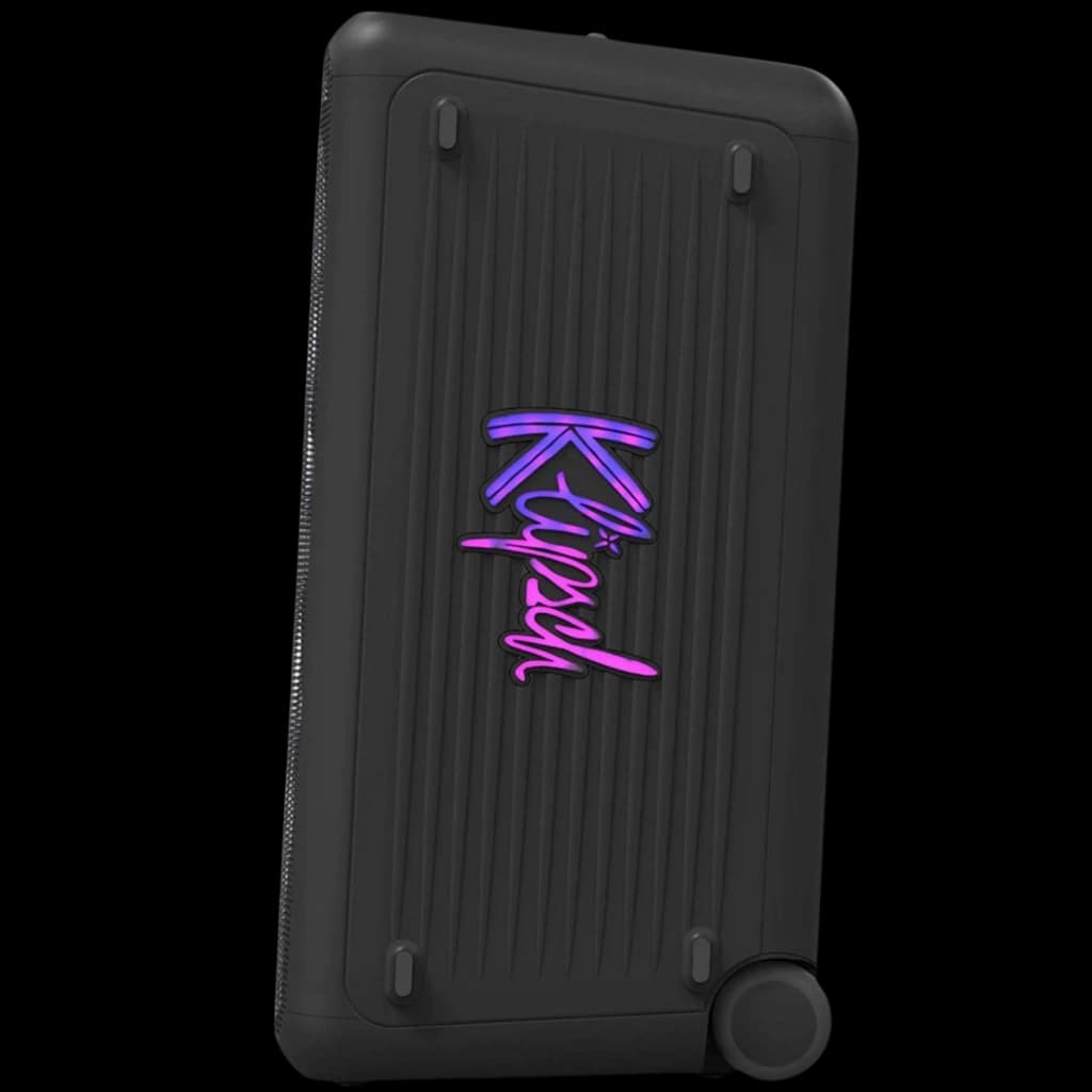 Klipsch Miami Bluetooth 18 h IPX4 en noir, boîtier rectangulaire robuste à reliefs, logo néon violet-rose, coins renforcés et bouton latéral circulaire