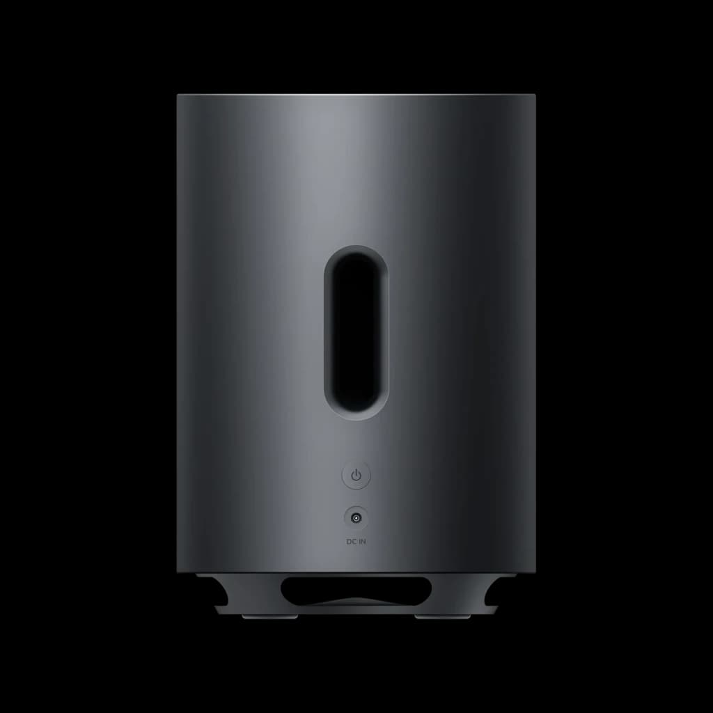 Subwoofer inalámbrico Xiaomi de acabado mate en gris oscuro, diseño cilíndrico con ranura central vertical, botón de encendido frontal y patas elevadas