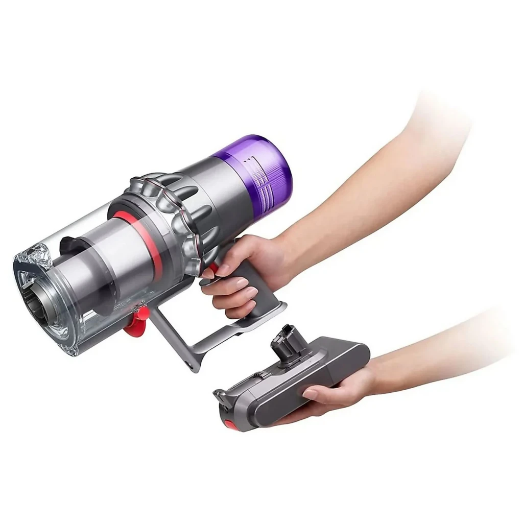 Aspiradora Escoba Dyson V15 Detect Absolute Rojo/Violeta Sin Cable 230AW 200W 60min, en uso: manos extrayendo la batería