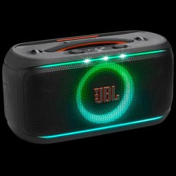 Enceinte JBL noire compacte avec anneau LED vert et barre lumineuse turquoise, grille avant perforée, logo orange, poignée intégrée et commandes