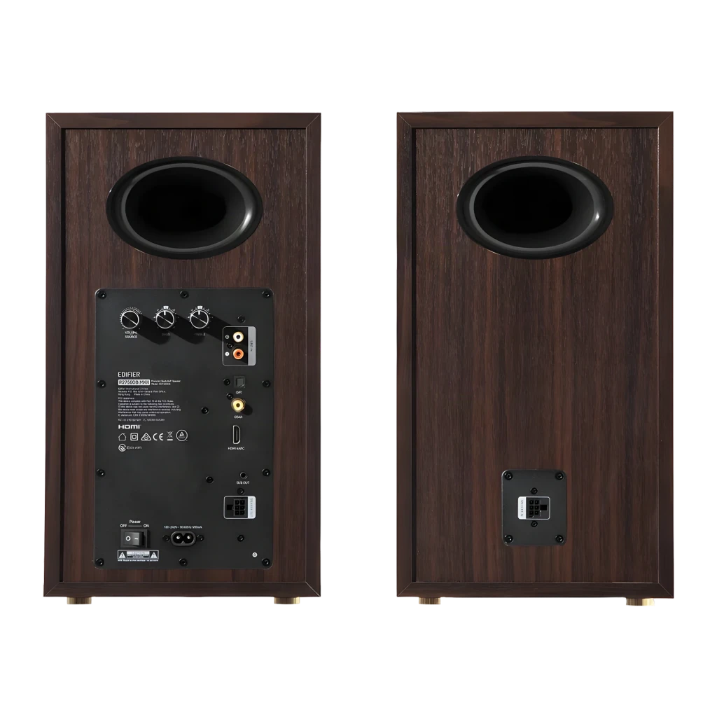 Par de altavoces de estantería negros con acabado en madera, rejilla textil removible y triple vía visible con woofer grande, midrange y tweeter frontal - Ítem2