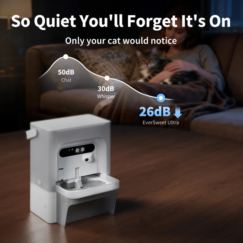 Fontaine blanche connectée avec bol en cascade, capteurs frontaux, badge garantie 2 ans et appli mobile affichée sur smartphone, design compact et anguleux - Ítem6