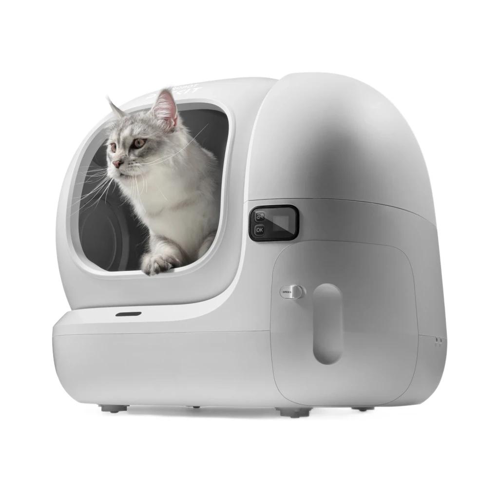 Litière autonettoyante PETKIT PUROBOT MAX 3 blanche, dôme XL avec grande ouverture, commande latérale, réservoir intégré et chat gris regardant dehors