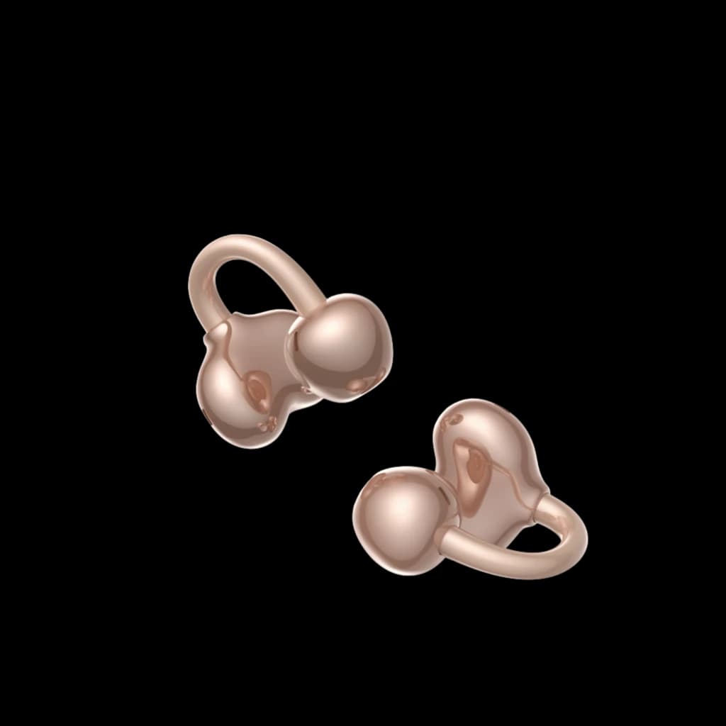 Auriculares Tronsmart OpenFly Clip S1010 de clip open-ear en color oro rosa, diseño minimalista y curvo, dos piezas con acabado metálico brillante