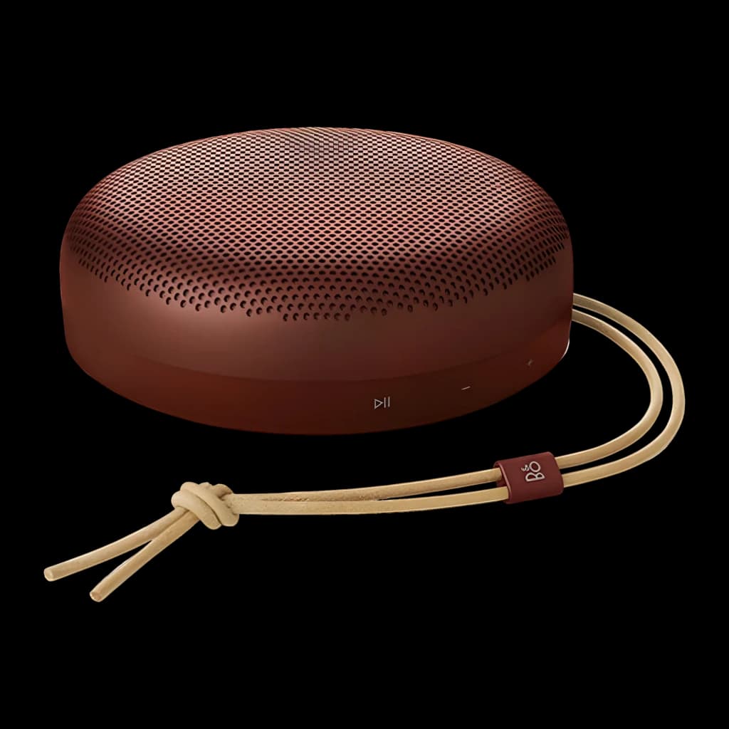 Bang & Olufsen BeoSound A1 3rd Gen Rojo Rústico, vista lateral: rejilla superior, botones frontales y cordón de cuero beige