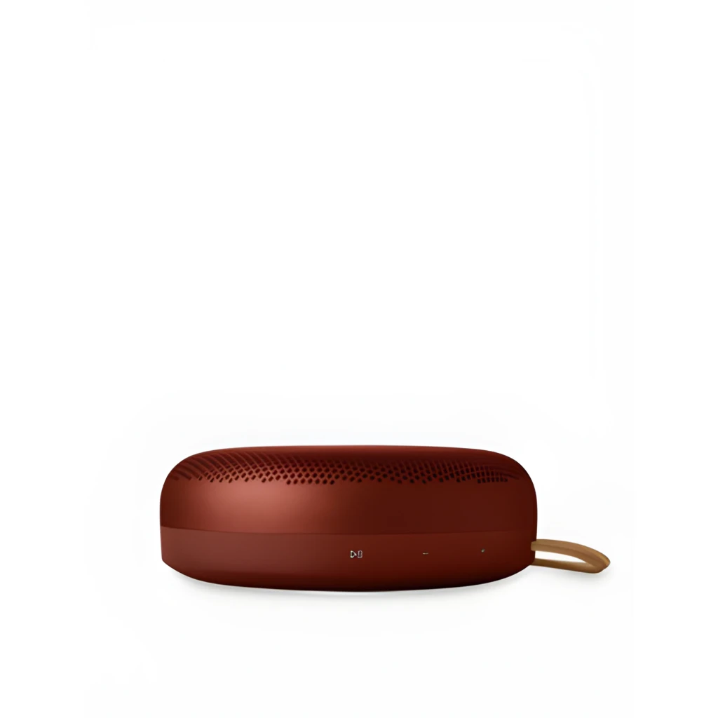 Bang & Olufsen BeoSound A1 3rd Gen Rouge Rustique, vue latérale: grille supérieure, boutons frontaux et cordon cuir beige - Ítem1