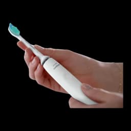 Philips Sonicare 2100 Series HX3651/13 blanc, vue en main: main tenant la brosse en angle diagonal, tête verte visible