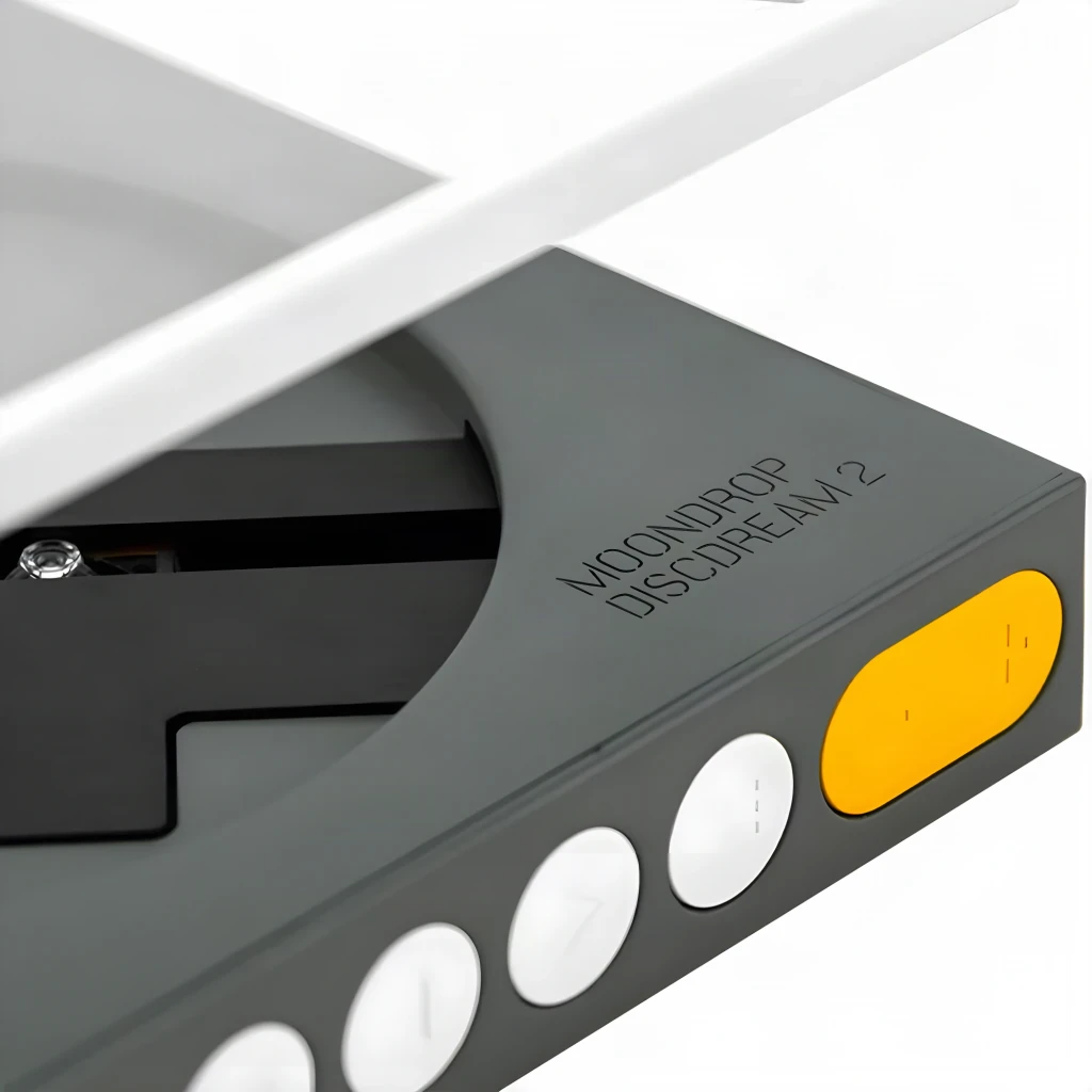 Reproductor CD Moondrop DISCDREAM 2 Portátil con tapa transparente cuadrada, controles frontales circulares, pantalla lateral y diseño minimalista en gris y - Ítem2