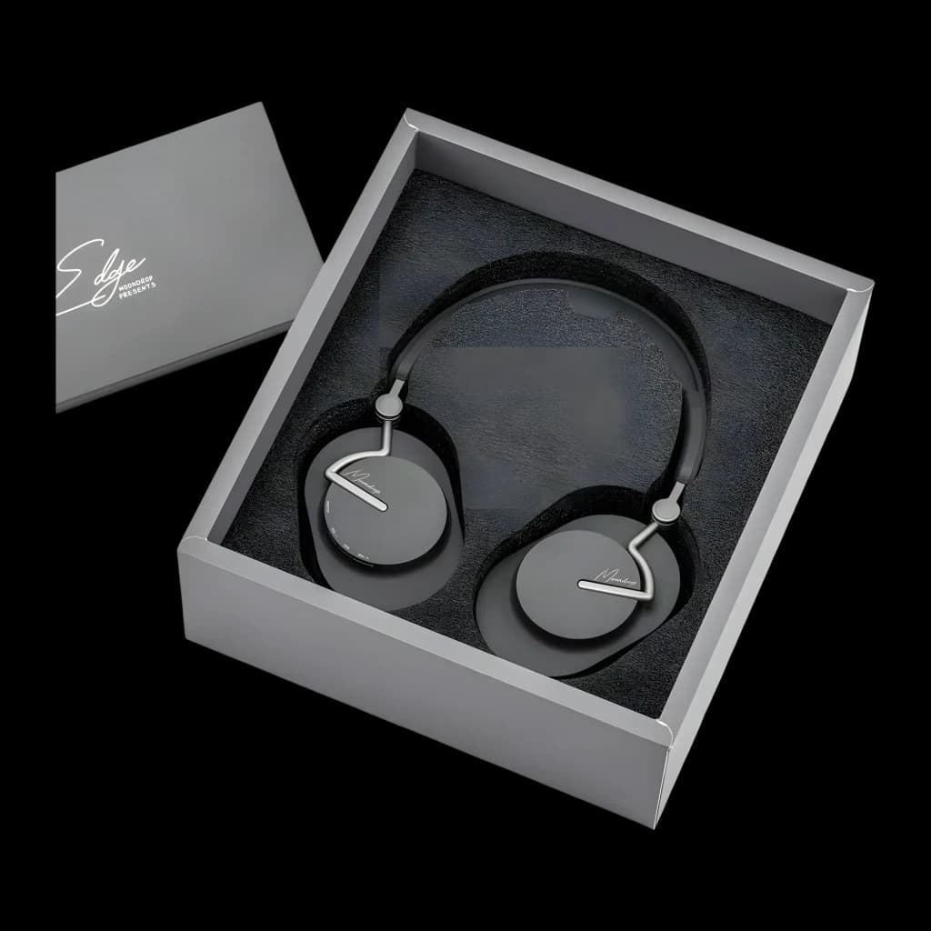 Casque Moondrop Edge Grey ANC hybride, arceau noir, oreillettes ovales grises au logo argenté, présenté dans un coffret gris avec mousse de protection