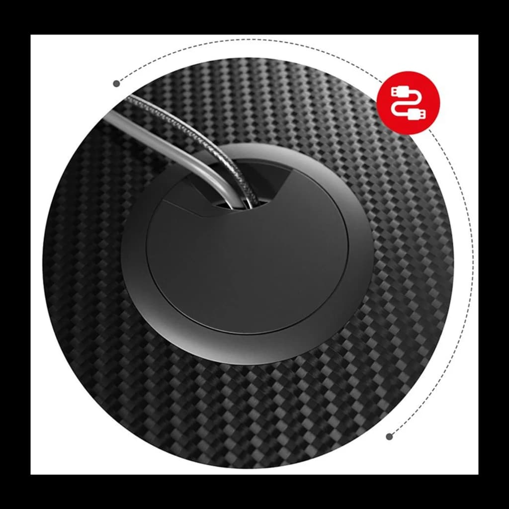 Huzaro Mesa gaming Hero 1.6 Negro, detalle: pasacables circular negro con cables sobre superficie carbono