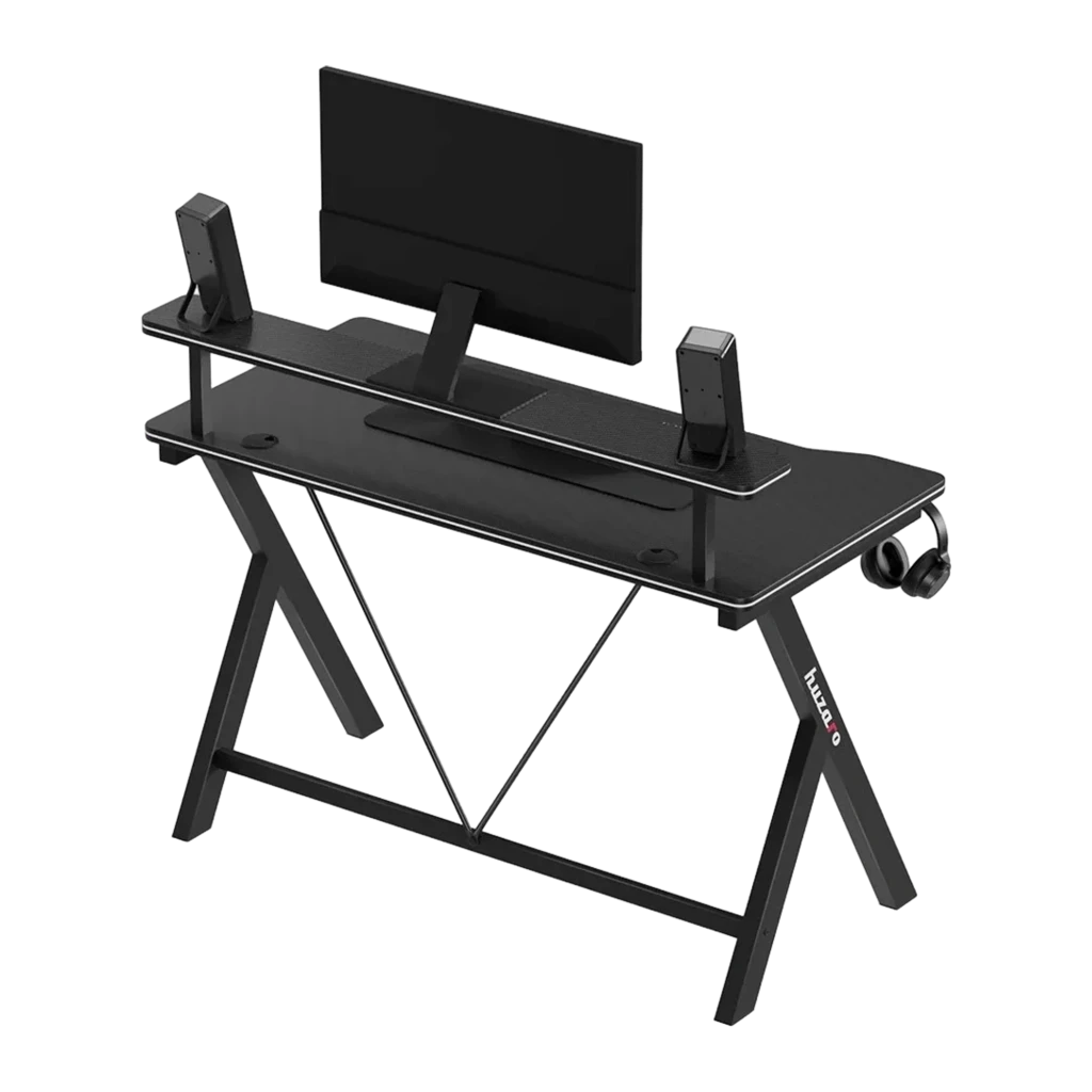 Huzaro Mesa gaming Hero 1.9 Noir, vue en angle: surface carbone, étagère surélevée avec moniteur et enceintes, crochet - Ítem2