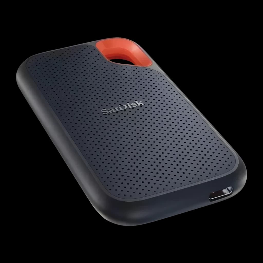 SanDisk SSD Portátil Extreme PRO 2TB preto com laranja, vista em perspectiva: textura perfurada, alça laranja e porta USB4
