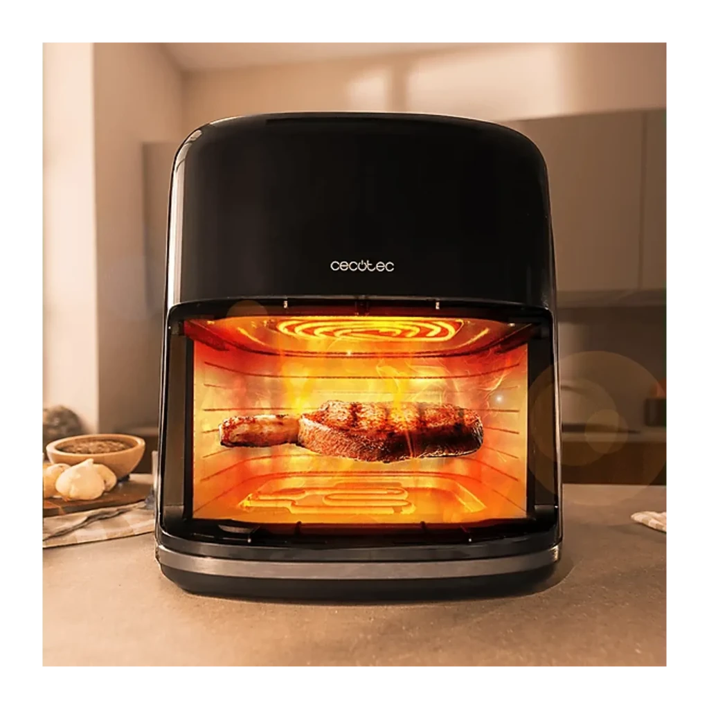 Cecotec Cecofry&Grill Smokin'Prime 6500 6,5L noir, vue de face en cuisine: intérieur éclairé avec viande grillée visible à