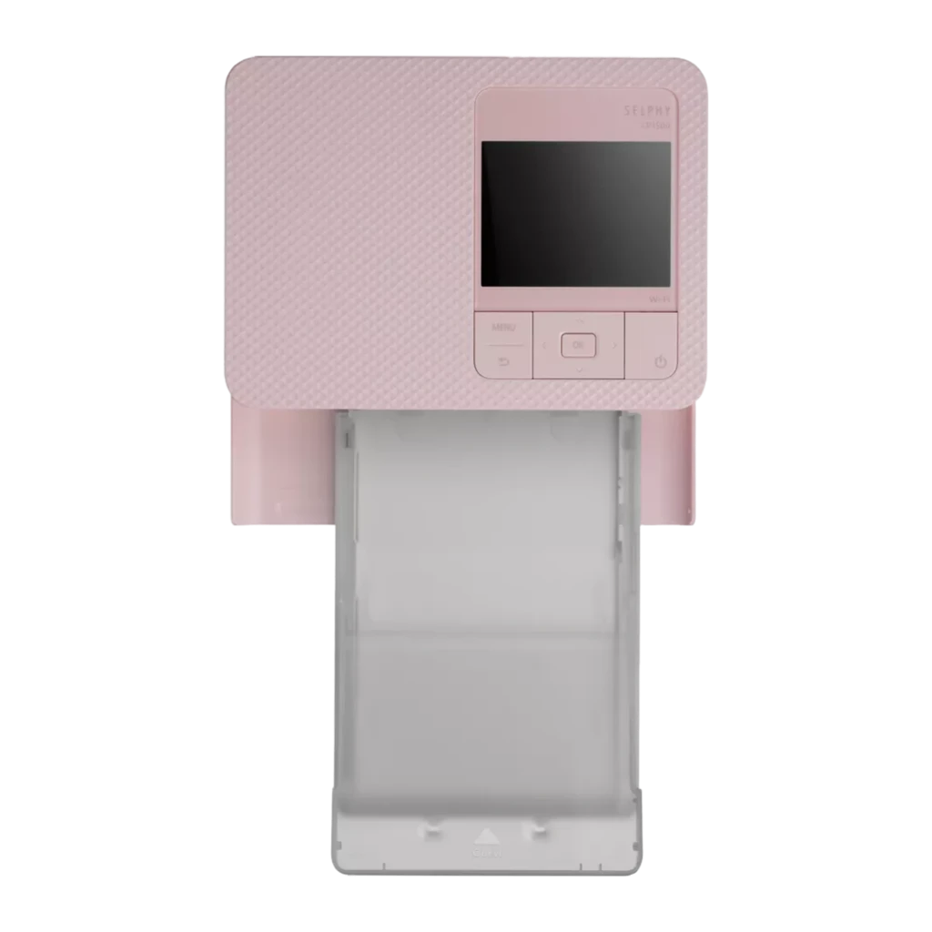 Canon SELPHY CP1500 Rosa, vista en perspectiva: bandeja de papel abierta y cassette de tinta visible, pantalla LCD en la - Ítem1