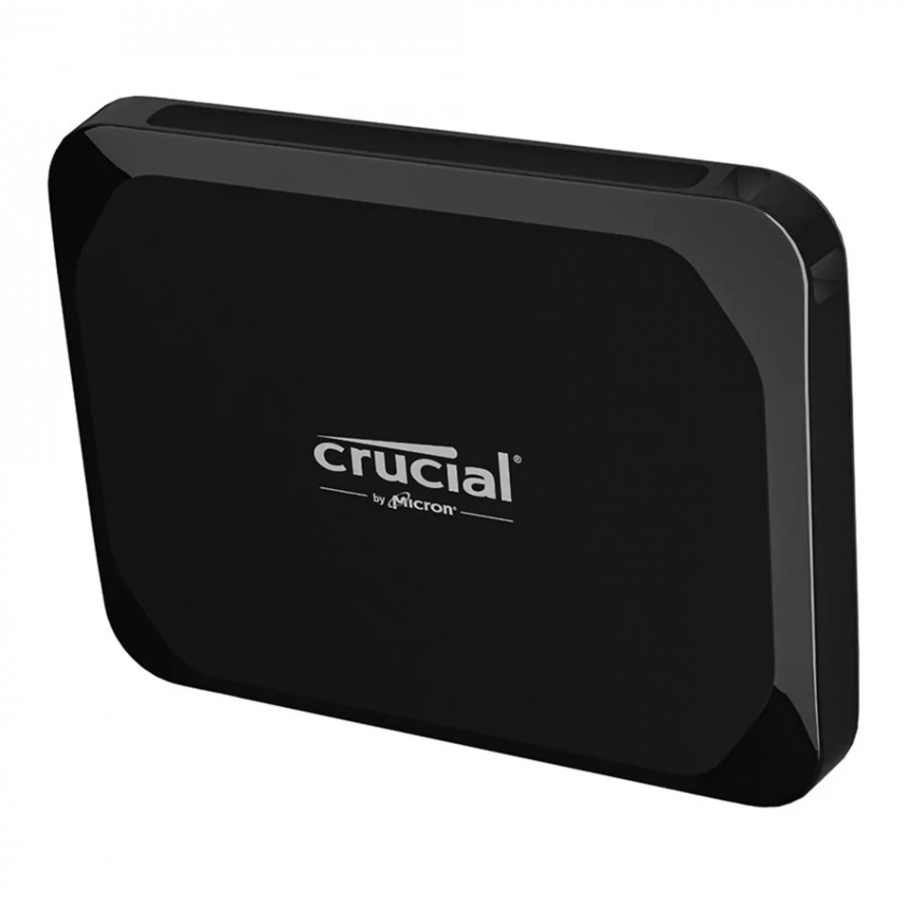 Crucial X9 1TB negro, vista frontal en ángulo: cuerpo compacto con logo Crucial by Micron y puerto USB-C lateral - Ítem2