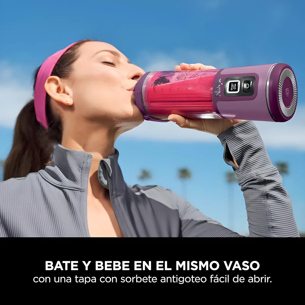 Ninja Blast BC151EU 530ml violet, vue de face: bol transparent avec mangue et glaçons, base avec boutons Start/Stop - Ítem3