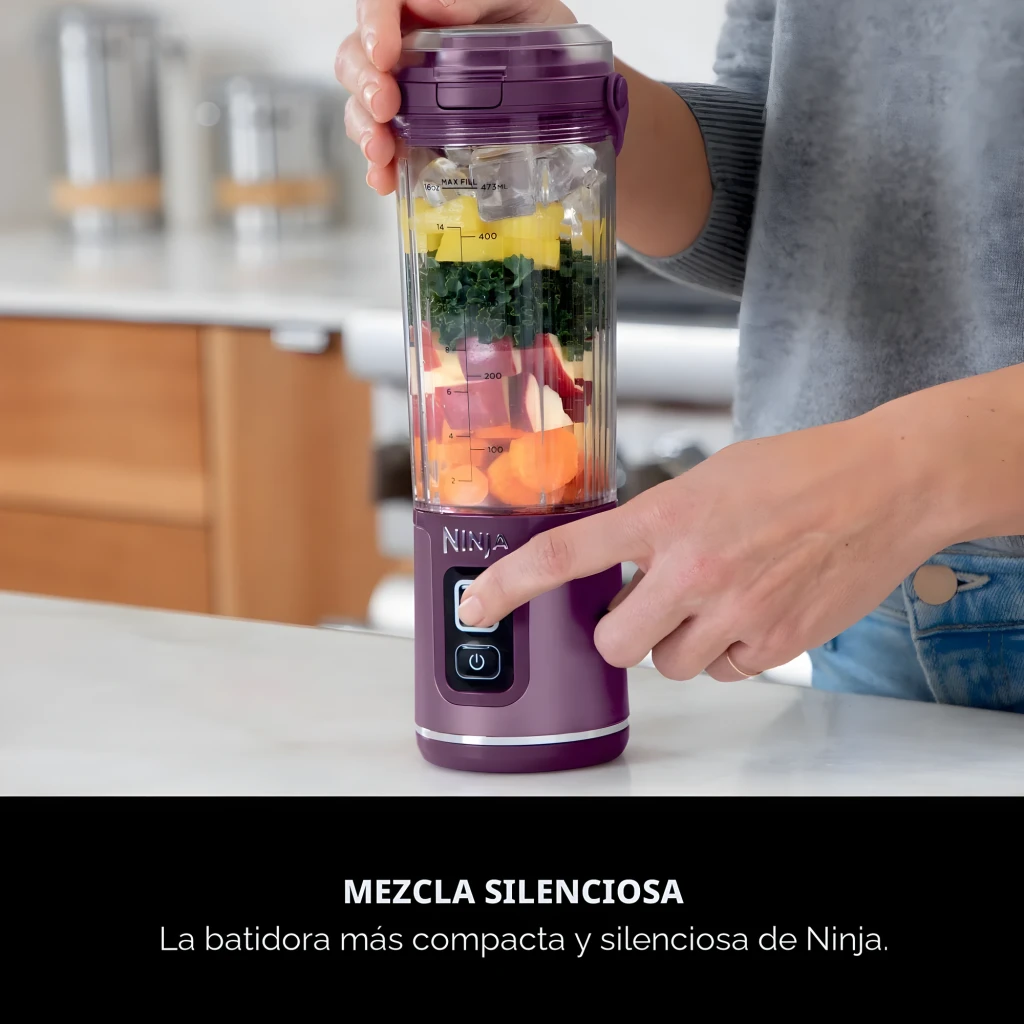 Ninja Blast BC151EU 530ml violet, vue de face: bol transparent avec mangue et glaçons, base avec boutons Start/Stop - Ítem6