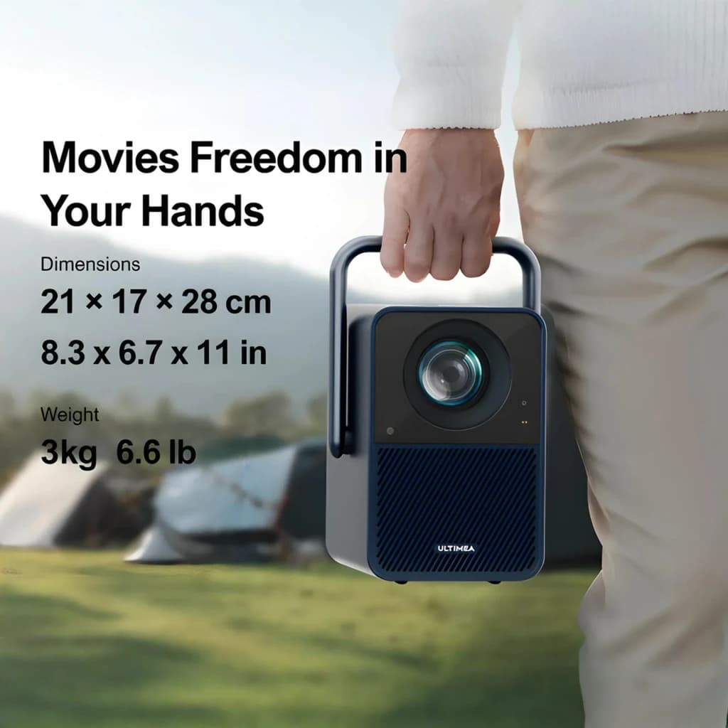 Ultimea Poseidon E40 4K Gris, portabilidad: mano sujetando el asa, lente frontal visible, escena exterior camping