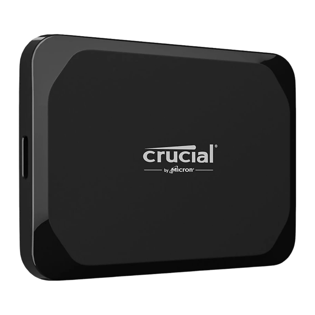 Crucial X9 Portable SSD 2TB negro, vista frontal en ángulo: cara superior con logo Crucial by Micron y esquinas redondeadas - Ítem1
