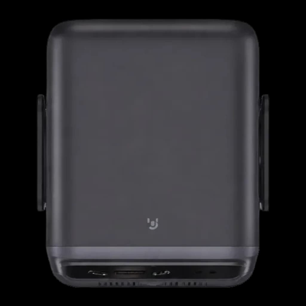 Boîtier du projecteur Wanbo Mozart 1S noir mat, compact avec poignées latérales, ports inférieurs visibles pour connectique et ventilation discrète
