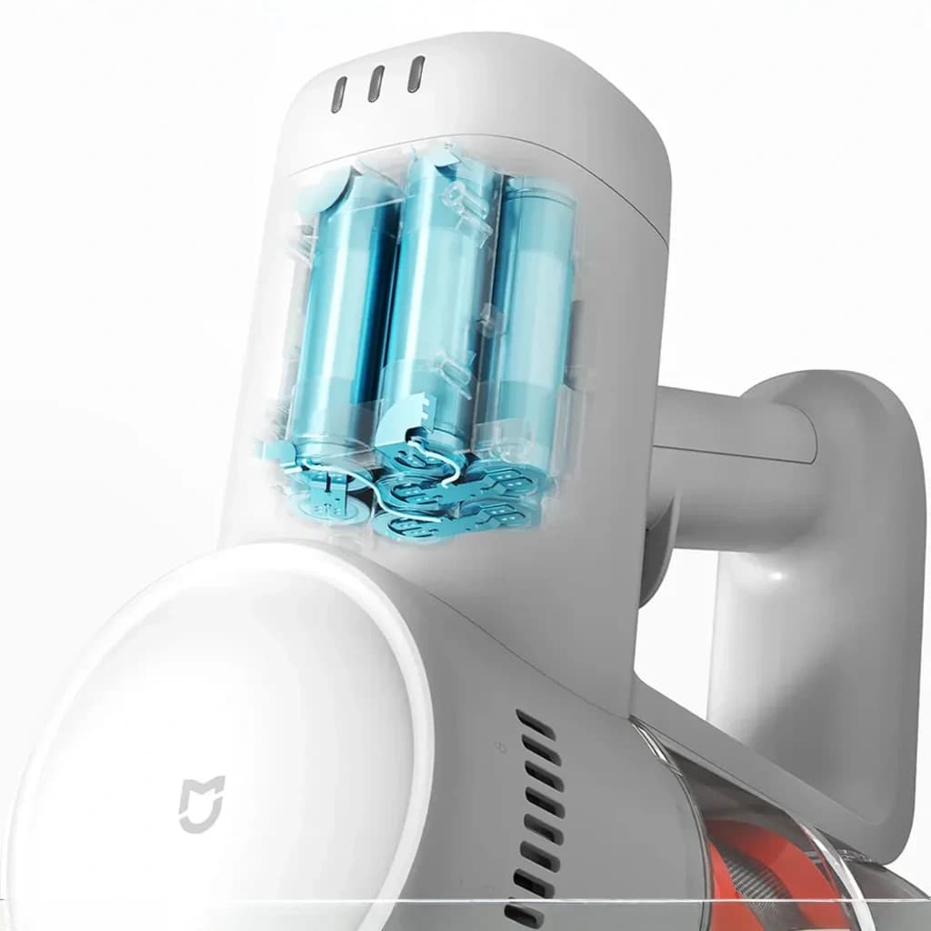 Cuerpo blanco con depósito transparente y módulo de baterías visibles en azul; diseño ergonómico de mano, ventilación lateral y cepillo motorizado en